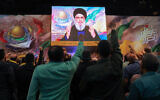 Hezbollah Secretary General Hassan Nasrallah delivers a televised speech during a gathering to mark annual Quds (Jerusalem) Day commemorations in Beirut's southern suburb on April 5, 2024. (Anwar Amro/AFP)