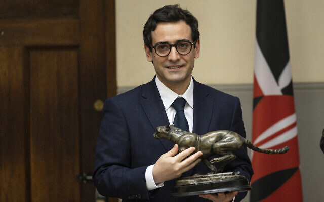 French Foreign Minister Stephane Sejourne poses with a gift in Nairobi, on April 6, 2024. (Simon Maina/AFP) French Foreign Minister Stephane Sejourne poses with a gift in Nairobi, on April 6, 2024. (Simon Maina/AFP)