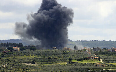 Smoke billows after an alleged Israeli strike on the southern Lebanese border village of Tayr Harfa on April 6, 2024. (Kawnat Haju/AFP)