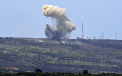 Illustrative: A picture taken from the southern Lebanese village of Alma al-Shaab shows smoke rising from an Israeli military outpost after a rocket attack by Lebanon's Hezbollah terror group, on April 6, 2024. (Kawnat Haju/AFP)