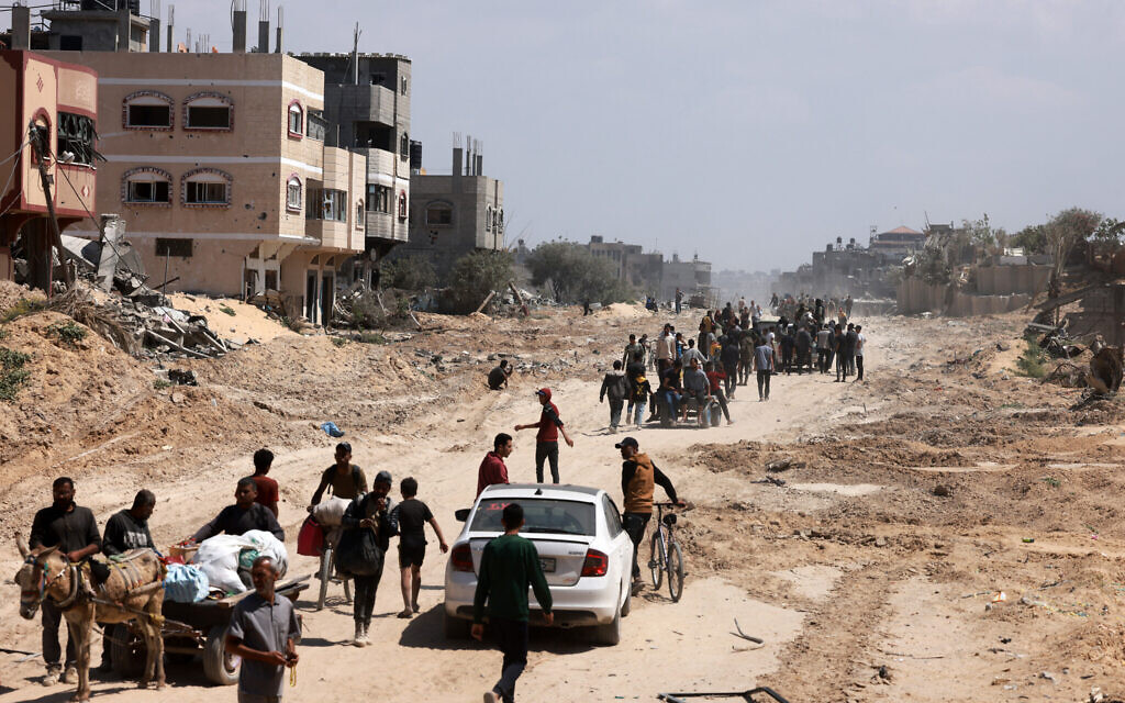 Illustrative: Palestinians who had taken refuge in Rafah, leave the city to return to Khan Younis after Israel pulled its ground forces out of the southern Gaza Strip, on April 7, 2024.(Mohammed Abed/AFP)
