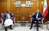 This handout picture provided by the Iranian foreign ministry on April 7, 2024, shows Foreign Minister Hossein Amir Abdollahian (R) meeting with Mohammad Abdul Salam, spokesman for the Yemen's Houthi movement, in Muscat. (Photo by Iranian Foreign Ministry / AFP)