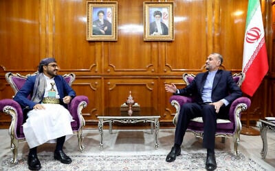 This handout picture provided by the Iranian foreign ministry on April 7, 2024, shows Foreign Minister Hossein Amir Abdollahian (R) meeting with Mohammad Abdul Salam, spokesman for the Yemen's Houthi movement, in Muscat. (Photo by Iranian Foreign Ministry / AFP)