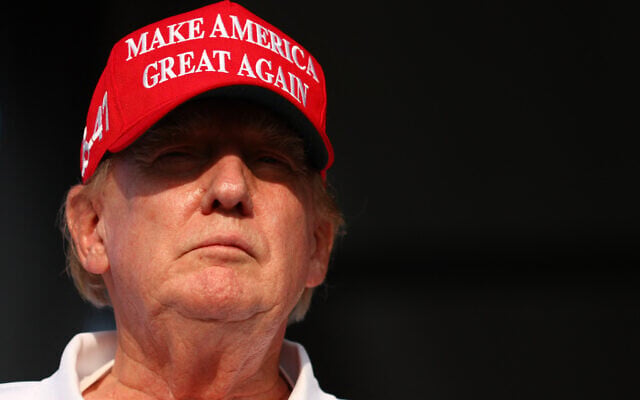 Former US president Donald Trump looks on at the 18th green during day three of the LIV Golf Invitational - Miami at Trump National Doral Miami on April 07, 2024 in Doral, Florida. (Megan Briggs/Getty Images North America/ Getty Images via AFP)