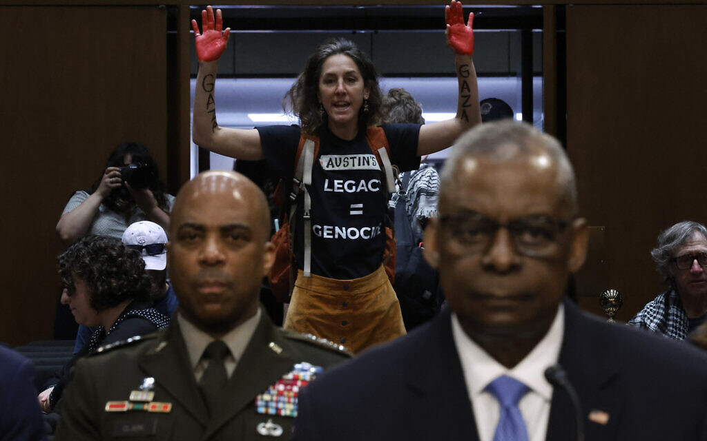 Protesters interrupted US Defense Secretary Lloyd Austin as he testified before the Senate Armed Services Committee in the Hart Senate Office Building on Capitol Hill on April 9, 2024 in Washington, DC. (Chip Somodevilla/Getty Images North America/Getty Images via AFP)