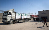 A truck carrying humanitarian aid arrives for processing at the Kerem Shalom border crossing with Gaza on April 15, 2024. (AFP)