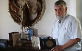 Former Israeli Mossad agent and author Mishka Ben-David is pictured at his home in Ramat Raziel on April 15, 2024. (Gil Cohen-Magen/AFP)