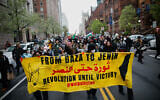 Pro-Palestinian, anti-Israel protesters march outside Columbia University in New York, April 18, 2024. (Kena Betancur/AFP)