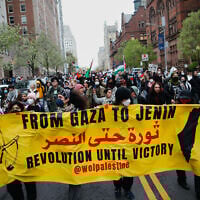 Pro-Palestinian, anti-Israel protesters march outside Columbia University in New York, April 18, 2024. (Kena Betancur/AFP)