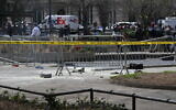 Police crime tape is strung at the site across from Manhattan Criminal Court in New York City after a man reportedly set himself on fire, April 19, 2024. (ANGELA WEISS / AFP)
