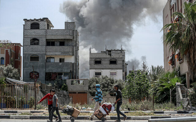 Smoke billows after an Israeli strike on a building in al-Bureij camp in the central Gaza Strip on April 22, 2024  (Photo by AFP)