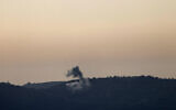 This picture taken from an Israeli position along the border with southern Lebanon shows smoke billowing above the Lebanese village of Odaisseh during Israeli strike on April 22, 2024(Photo by Jalaa MAREY / AFP)