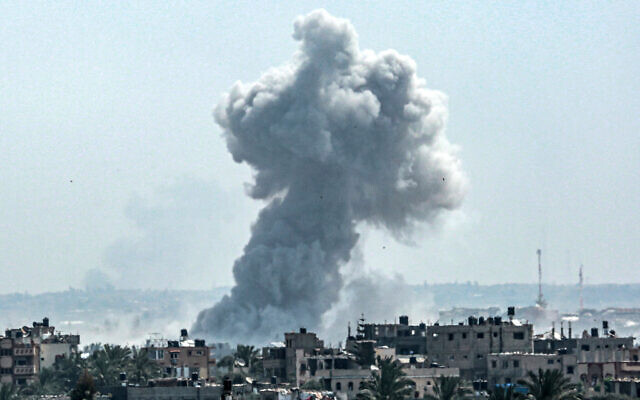 A smoke plume billows following Israeli strike north of Nuseirat in the central Gaza Strip on April 23, 2024. (AFP) A smoke plume billows following Israeli strike north of Nuseirat in the central Gaza Strip on April 23, 2024. (AFP)