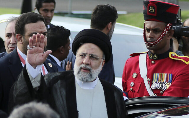 Iran's President Ebrahim Raisi waves upon arriving at Bandaranaike International Airport in Katunayake near Colombo on April 24, 2024. (Ishara S.Kodikara/AFP)