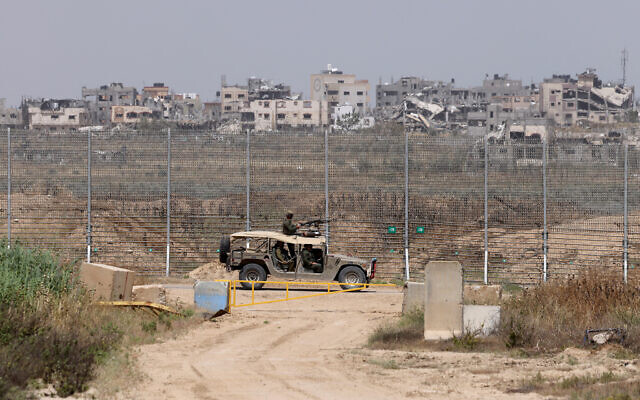This picture taken from southern Israel shows an Israeli military vehicle patrolling along the Gaza border on April 24, 2024. (Jack Guez/AFP)