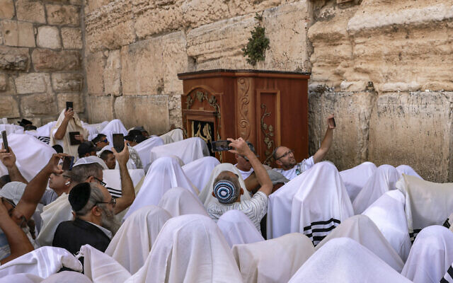 A group of Jewish worshipers recite the Passover priestly blessing at the Western Wall in the Old City of Jerusalem on April 25, 2024.(Menahem Kahana/AFP)