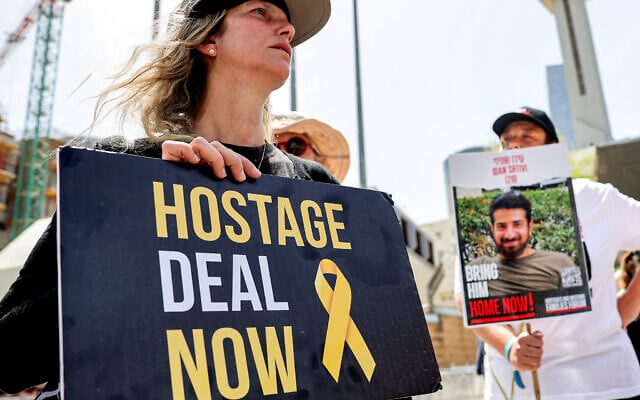 Relatives of Israeli hostages held in Gaza since October 7 protest outside the Defense Ministry headquarters in Tel Aviv on April 25, 2024. (Jack Guez/AFP) Relatives of Israeli hostages held in Gaza since October 7 protest outside the Defense Ministry headquarters in Tel Aviv on April 25, 2024. (Jack Guez/AFP)
