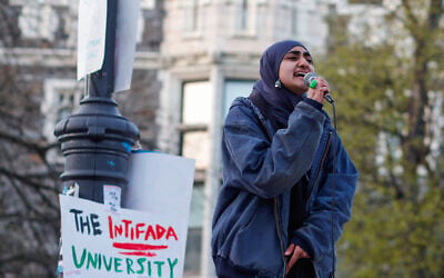 A woman shouts slogans as anti-Israel protesters gather on the campus of The City College of New York, April 25, 2024. (Kena Betancur/AFP) A woman shouts slogans as anti-Israel protesters gather on the campus of The City College of New York, April 25, 2024. (Kena Betancur/AFP)