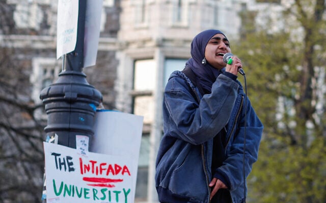 A woman shouts slogans as anti-Israel protesters gather on the campus of The City College of New York, April 25, 2024. (Kena Betancur/AFP) A woman shouts slogans as anti-Israel protesters gather on the campus of The City College of New York, April 25, 2024. (Kena Betancur/AFP)