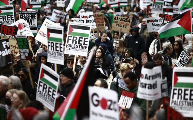 Pro-Palestinian supporters hold placards and wave Palestinian flags during a demonstration against Israel outside Westminster Palace in central London, on April 27, 2024. (Benjamin Cremel/AFP) Pro-Palestinian supporters hold placards and wave Palestinian flags during a demonstration against Israel outside Westminster Palace in central London, on April 27, 2024. (Benjamin Cremel/AFP)