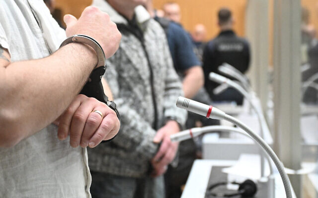 One of nine suspected participants in a coup plot wears handcuffs as he is brought to the courtroom to take the stand in the first set of proceedings in Stuttgart, southern Germany, on April 29, 2024. (Bernd Weißbrod/POOL/AFP) One of nine suspected participants in a coup plot wears handcuffs as he is brought to the courtroom to take the stand in the first set of proceedings in Stuttgart, southern Germany, on April 29, 2024. (Bernd Weißbrod/POOL/AFP)