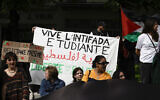Students shout slogans and display a banner reading "Long live the student intifada" as they take part in an anti-Israel rally at the Sorbonne University in Paris on April 29, 2024. (Geoffroy Van Der Hasselt/AFP)