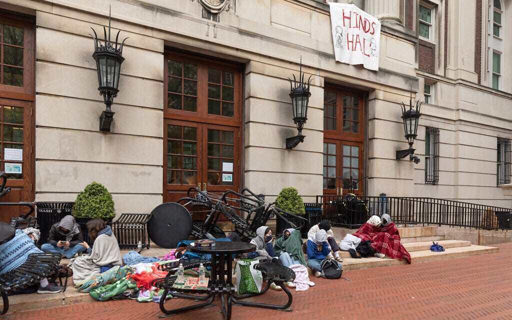 Anti-Israel student protesters sit outside of the occupied Hamilton Hall at Columbia University in New York City on April 30, 2024. (Emily Byrski/AFP) Anti-Israel student protesters sit outside of the occupied Hamilton Hall at Columbia University in New York City on April 30, 2024. (Emily Byrski/AFP)