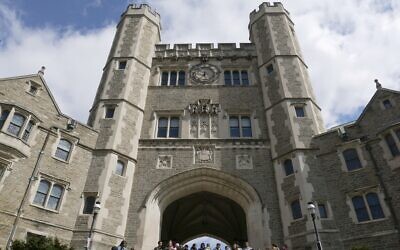 FILE - In this April 5, 2018, file photo, people walk through the Princeton University campus in Princeton, New Jersey. (AP Photo/Seth Wenig, File)