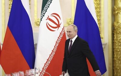 Russian President Vladimir Putin arrives to attend talks with Iranian President Ebrahim Raisi at the Kremlin in Moscow, Russia, December 7, 2023. (Sergei Bobylev/Sputnik, Kremlin Pool Photo via AP)