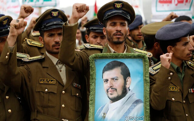 File: Houthi supporters attend a rally against the US-led strikes against Yemen and in the support of Palestinians in the Gaza Strip, in Sanaa, Yemen, February 16, 2024, holding a photo of Houthi leader Abdul Malik al-Houthi. (AP Photo/Osamah Abdulrahman)