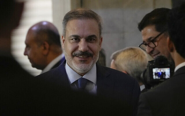 Turkish Foreign Affairs Minister Hakan Fidan, center, arrives at the foreign ministry in Baghdad, Iraq, March 14, 2024. (AP Photo/Hadi Mizban) Turkish Foreign Affairs Minister Hakan Fidan, center, arrives at the foreign ministry in Baghdad, Iraq, March 14, 2024. (AP Photo/Hadi Mizban)