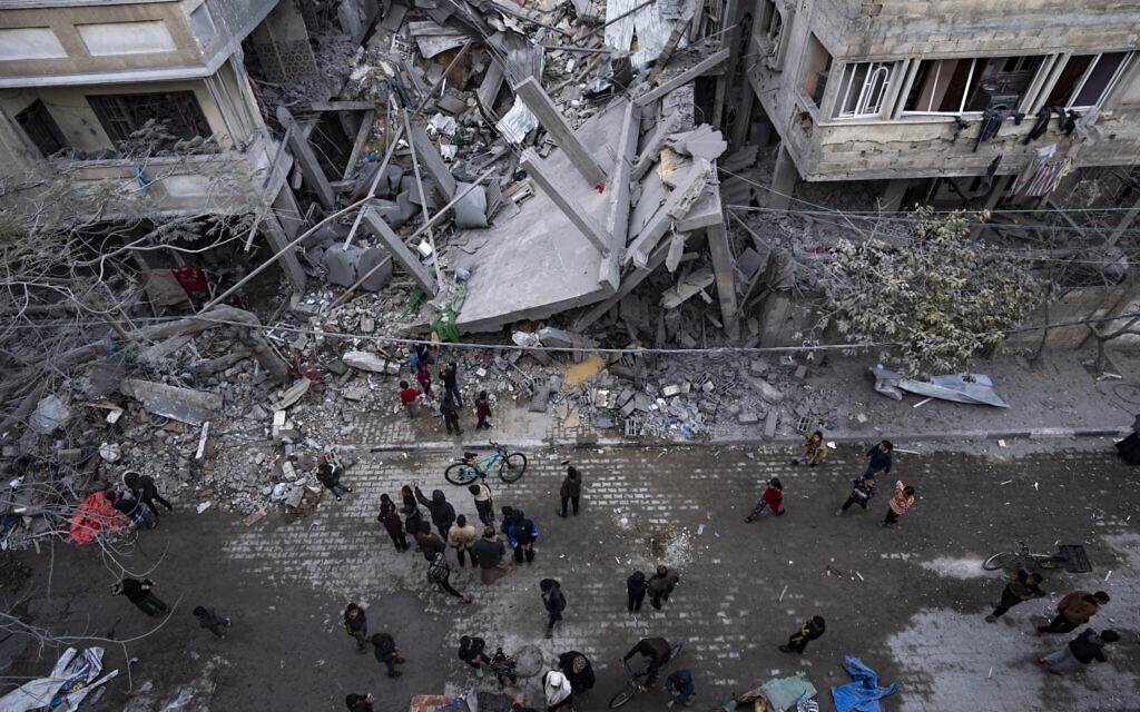 Illustrative: Palestinians inspect the damage to residential buildings after an Israeli airstrike in Rafah, southern Gaza Strip, March 24, 2024. (AP Photo/Fatima Shbair) Illustrative: Palestinians inspect the damage to residential buildings after an Israeli airstrike in Rafah, southern Gaza Strip, March 24, 2024. (AP Photo/Fatima Shbair)