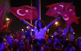 Republican People's Party, or CHP, supporters gather to celebrate outside City Hall in Istanbul, Turkey, March 31, 2024. (AP Photo/Khalil Hamra)