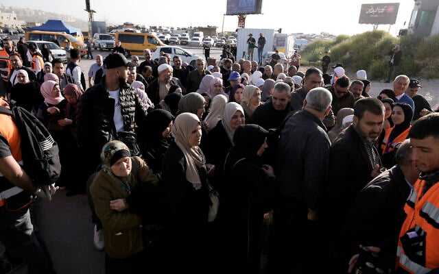 Palestinians wait to cross into Jerusalem from the West Bank on their way to the Al-Aqsa Mosque compound atop the Temple Mount for the last Friday prayers of the Muslim holy month of Ramadan, at the Qalandia checkpoint, April 5, 2024. (AP/Majdi Mohammed) Palestinians wait to cross into Jerusalem from the West Bank on their way to the Al-Aqsa Mosque compound atop the Temple Mount for the last Friday prayers of the Muslim holy month of Ramadan, at the Qalandia checkpoint, April 5, 2024. (AP/Majdi Mohammed)
