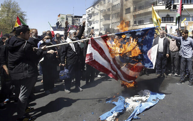 Iranian demonstrators burn US and Israeli flags during an annual rally to mark Quds Day, or Jerusalem Day, in support of Palestinians and against Israel, in Tehran, Iran, Friday, April 5, 2024. (AP Photo/Vahid Salemi) Iranian demonstrators burn US and Israeli flags during an annual rally to mark Quds Day, or Jerusalem Day, in support of Palestinians and against Israel, in Tehran, Iran, Friday, April 5, 2024. (AP Photo/Vahid Salemi)