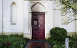 Traces of fire can be seen on a synagogue entrance door damaged by an incendiary device in Oldenburg, Germany, April 5, 2024. (Hauke-Christian Dittrich/dpa via AP)