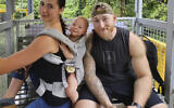 This undated photo provided by John Flickinger, April 5, 2024, shows Sandy Leclerc, left, and Jacob Flickinger with their son Jasper. (John Flickinger via AP)