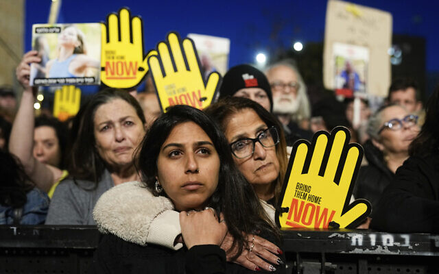 Israeli demonstrators call on the government to secure the release of hostages held in the Gaza Strip by Hamas during a rally marking six months since the outbreak of war against the terror group, outside the Knesset in Jerusalem, April 7, 2024. (AP Photo/Ohad Zwigenberg)
