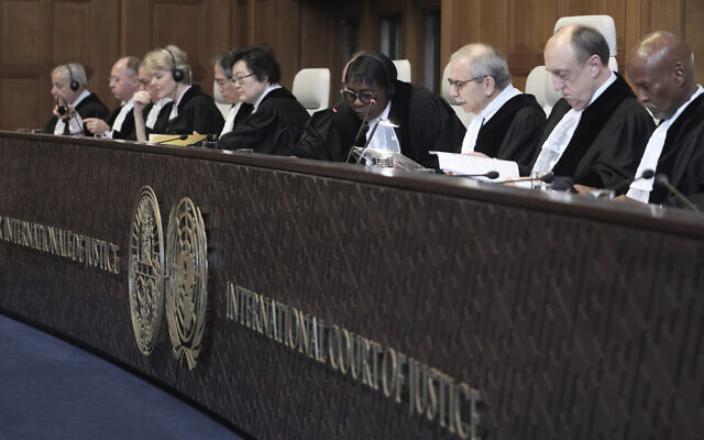 Judge Nawaf Salam, third right, speaks at the start of a two days hearing at the World Court in The Hague, Netherlands, Monday, April 8, 2024, in a case brought by Nicaragua accusing Germany of breaching the genocide convention by providing arms and support to Israel. (AP Photo/Patrick Post)