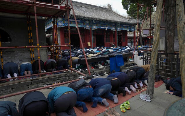 Muslim men offer the Eid al-Fitr prayers to mark the end of the holy fasting month of Ramadan at the Niujie Mosque in Beijing, China, April 10, 2024. (Tatan Syuflana/AP)