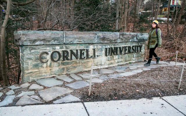 FILE - A woman walks by a Cornell University sign on the Ivy League school's campus, Jan. 14, 2022, in Ithaca, New York. (AP Photo/Ted Shaffrey, File) FILE - A woman walks by a Cornell University sign on the Ivy League school's campus, Jan. 14, 2022, in Ithaca, New York. (AP Photo/Ted Shaffrey, File)