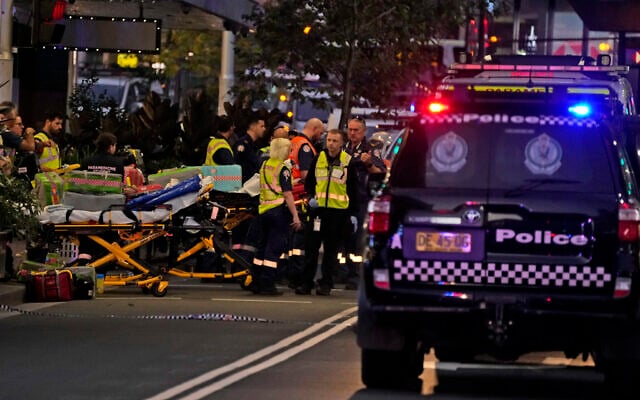 Emergency officers stand by with stretchers outside Westfield Shopping Centre where multiple people were stabbed in Sydney, April 13, 2024 (AP Photo/Rick Rycroft) Emergency officers stand by with stretchers outside Westfield Shopping Centre where multiple people were stabbed in Sydney, April 13, 2024 (AP Photo/Rick Rycroft)