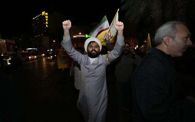 An Iranian cleric chants slogans while attending an anti-Israeli gathering at the Felestin (Palestine) Square in Tehran, Iran, early Sunday, April 14, 2024. (AP Photo/Vahid Salemi)