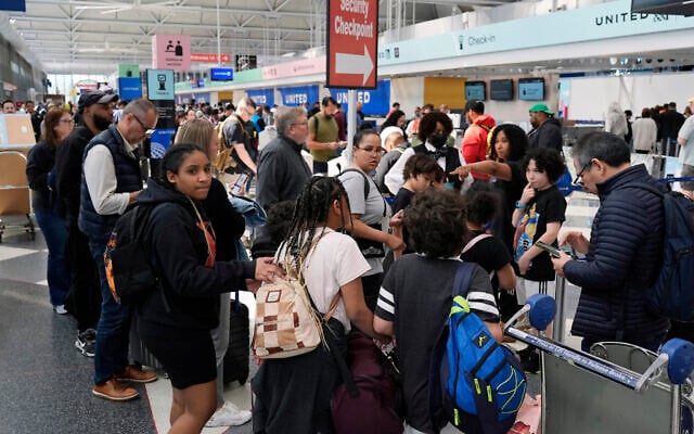 Passengers walk to a security checkpoint at O'Hare International Airport in Chicago, April 15, 2024. (AP Photo/Nam Y. Huh) Passengers walk to a security checkpoint at O'Hare International Airport in Chicago, April 15, 2024. (AP Photo/Nam Y. Huh)