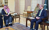 Visiting Saudi Foreign Minister Prince Faisal bin Farhan, left, listens to Pakistan's Prime Minister Shehbaz Sharif during a meeting in Islamabad, Pakistan, April 16, 2024. (Prime Minister Office via AP)