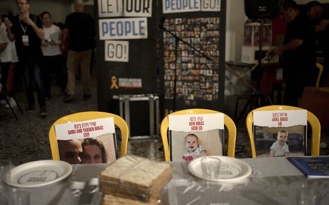 Chairs for the Bibas family, hostages held in Gaza, are seen at a Passover seder table set, Thursday, April 11, 2024, at the communal dining hall at Kibbutz Nir Oz in southern Israel, where a quarter of all residents were killed or captured by Hamas on Oct. 7, 2023. (AP Photo/Maya Alleruzzo, File) Chairs for the Bibas family, hostages held in Gaza, are seen at a Passover seder table set, Thursday, April 11, 2024, at the communal dining hall at Kibbutz Nir Oz in southern Israel, where a quarter of all residents were killed or captured by Hamas on Oct. 7, 2023. (AP Photo/Maya Alleruzzo, File)