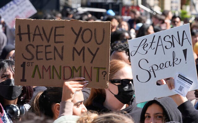 University of Southern Californian students carry signs protesting the cancelation of a commencement speech by the institution's 2024 valedictorian who has publicly supported Palestinians during Israel's war in Gaza, been accused of antisemitism and shared virulently anti-Israel content, on the USC campus in Los Angeles, California, April 18, 2024. (AP Photo/Damian Dovarganes) University of Southern Californian students carry signs protesting the cancelation of a commencement speech by the institution's 2024 valedictorian who has publicly supported Palestinians during Israel's war in Gaza, been accused of antisemitism and shared virulently anti-Israel content, on the USC campus in Los Angeles, California, April 18, 2024. (AP Photo/Damian Dovarganes)