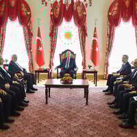 Turkey's President Recep Tayyip Erdogan, center, and ministers of his government, right, meet with Hamas delegation led by Ismail Haniyeh, in Istanbul, Turkey, April 20, 2024. (Turkish Presidency via AP)