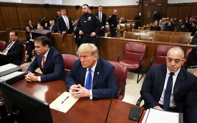 Former US President Donald Trump, center, awaits the start of proceedings at Manhattan criminal court in New York on April 22, 2024. (AP/Yuki Iwamura, Pool)