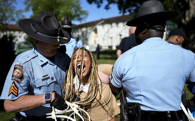Georgia State Patrol officers detain a demonstrator on the campus of Emory University during a pro-Palestinian demonstration, April 25, 2024, in Atlanta. (AP Photo/Mike Stewart)